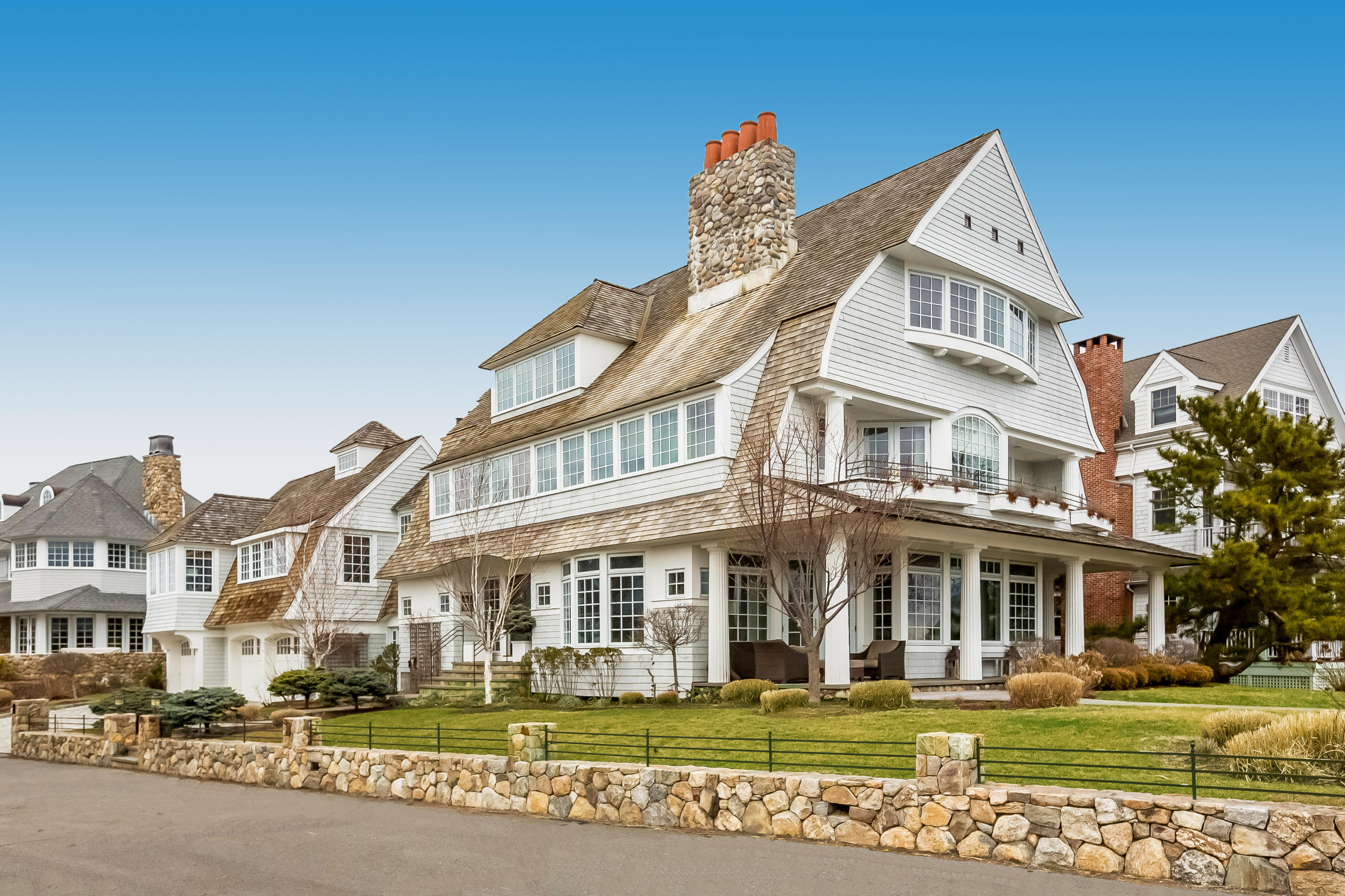 13 Crescent Beach Road Rowayton, CT 06853 - Photo 1 of 40 a front view of a building with a garden