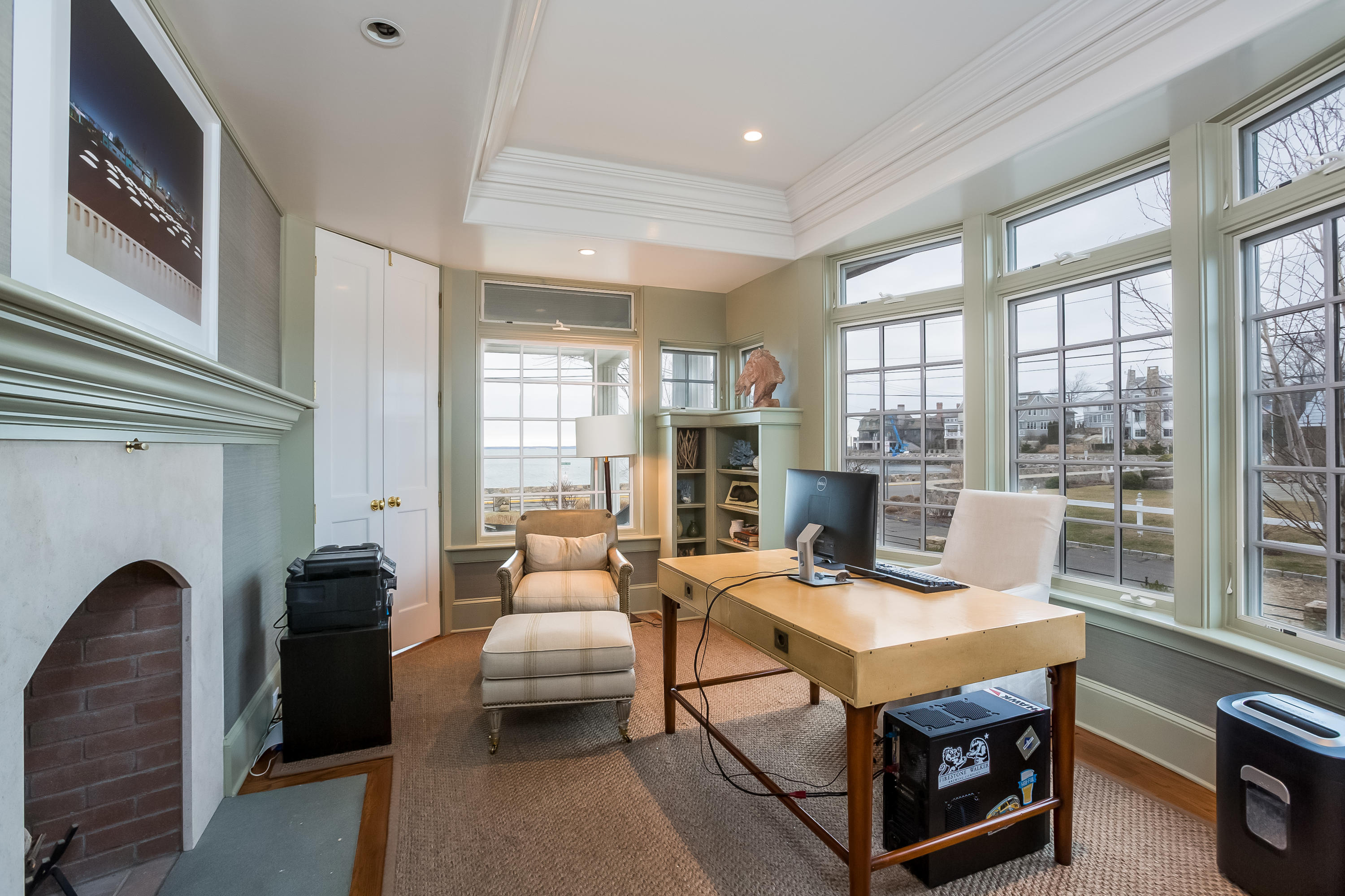 13 Crescent Beach Road Rowayton, CT 06853 - Photo 19 of 40 a living room with furniture a fireplace and large windows