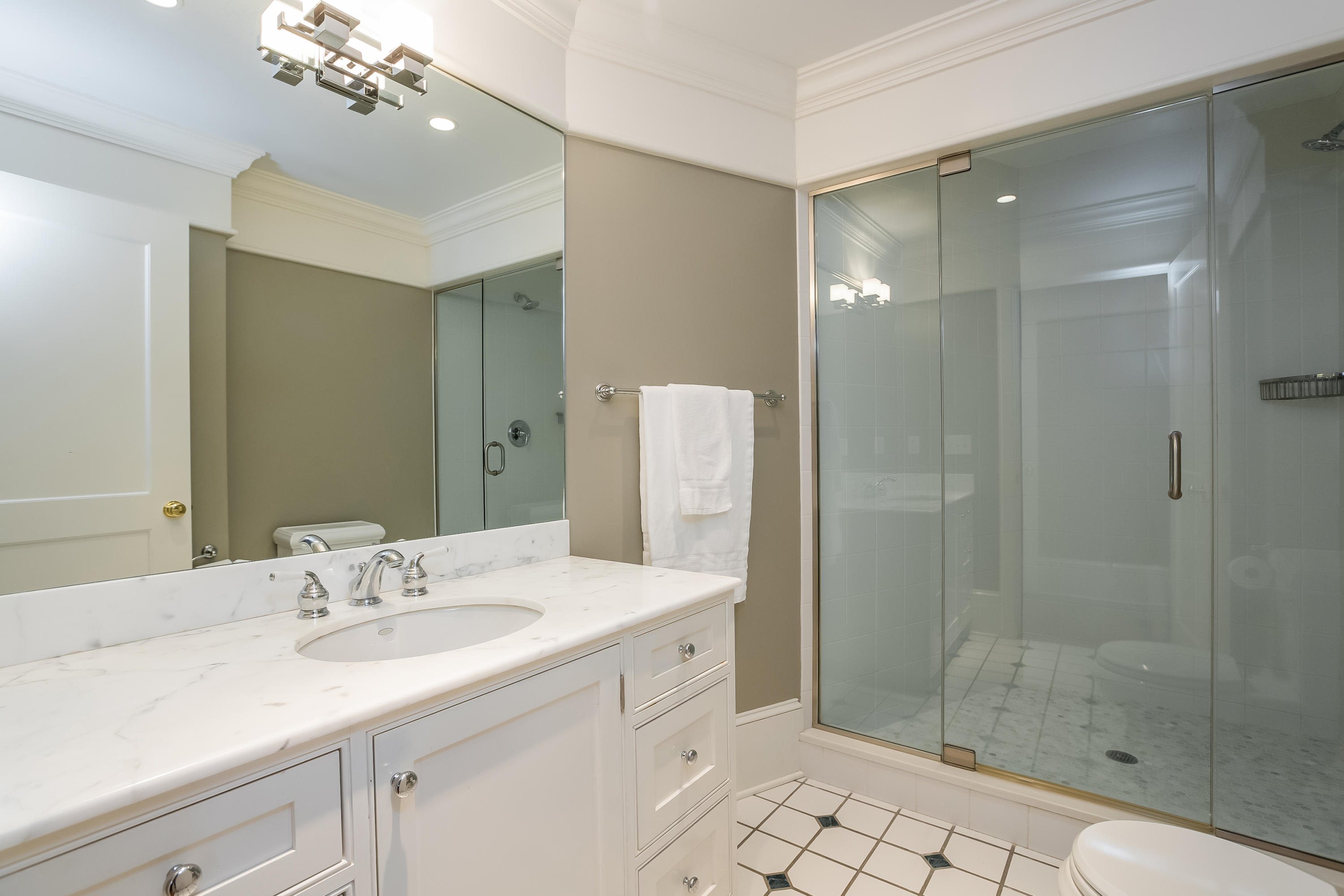 13 Crescent Beach Road Rowayton, CT 06853 - Photo 26 of 40 a spacious bathroom with a shower sink mirror and