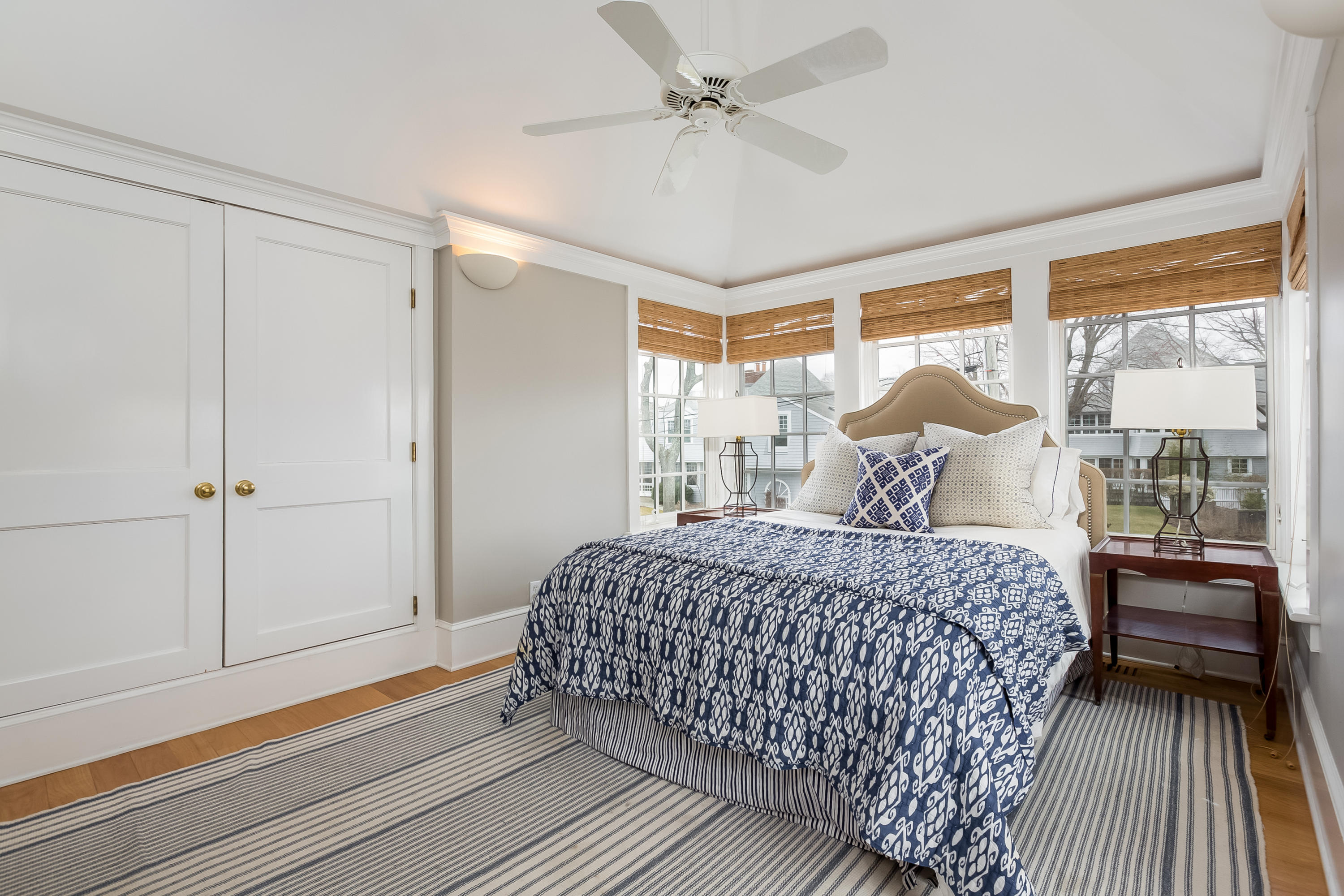 13 Crescent Beach Road Rowayton, CT 06853 - Photo 31 of 40 a bedroom with a bed and large window