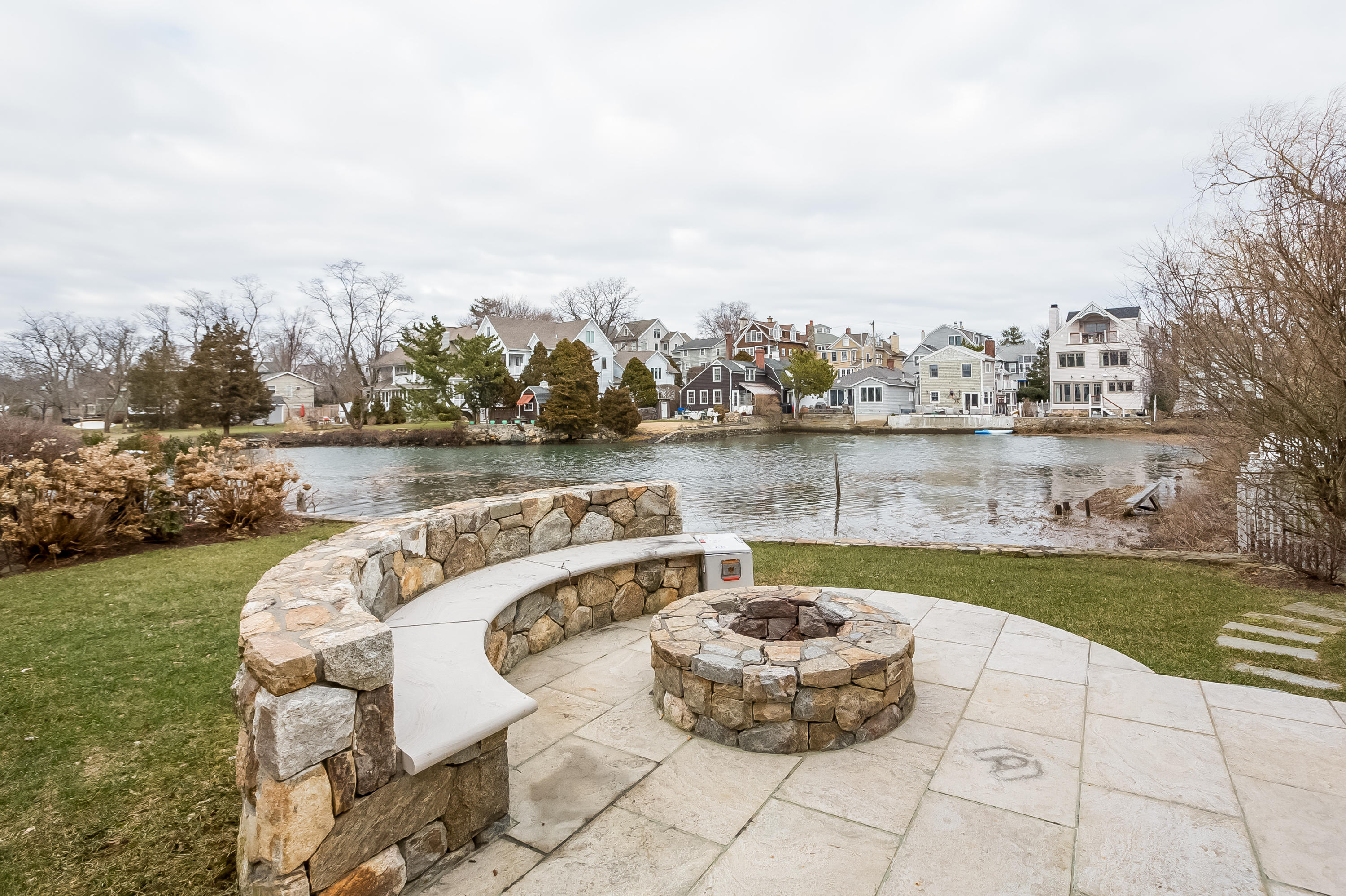 13 Crescent Beach Road Rowayton, CT 06853 - Photo 36 of 40 a view of a backyard with sitting area and lake view