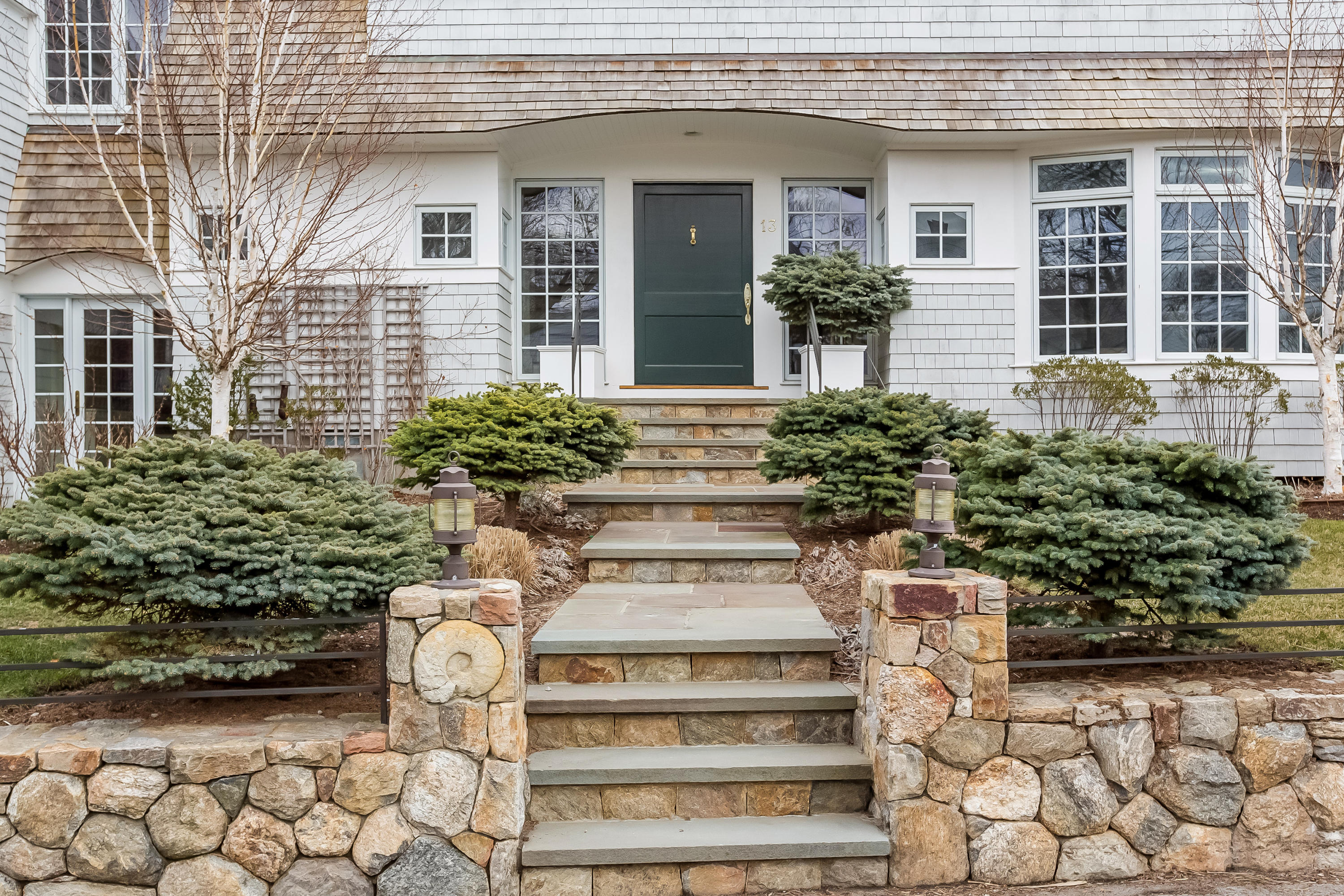 13 Crescent Beach Road Rowayton, CT 06853 - Photo 7 of 40 a view of house with wooden bench and potted plants
