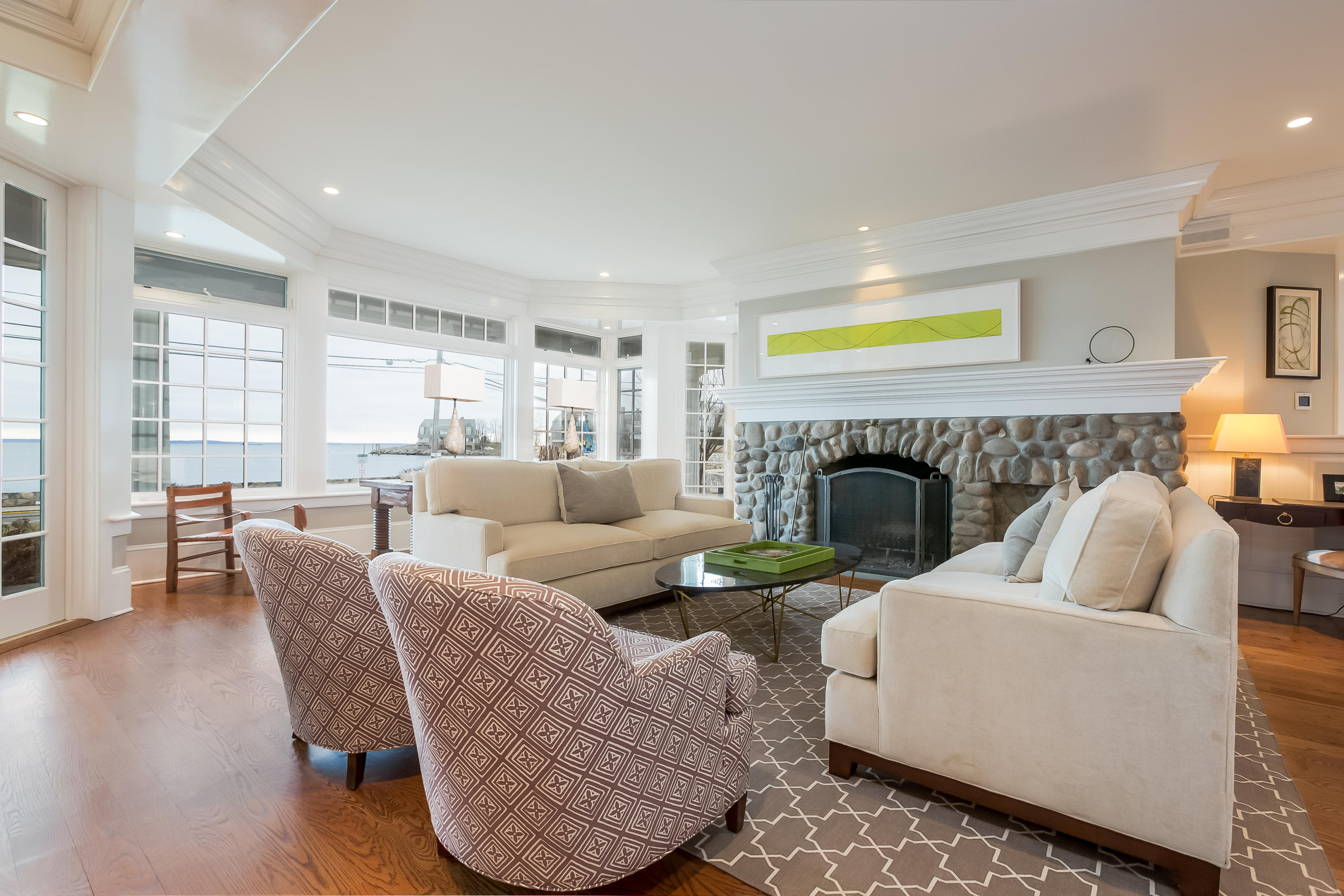 13 Crescent Beach Road Rowayton, CT 06853 - Photo 10 of 40 a living room with furniture and a fireplace