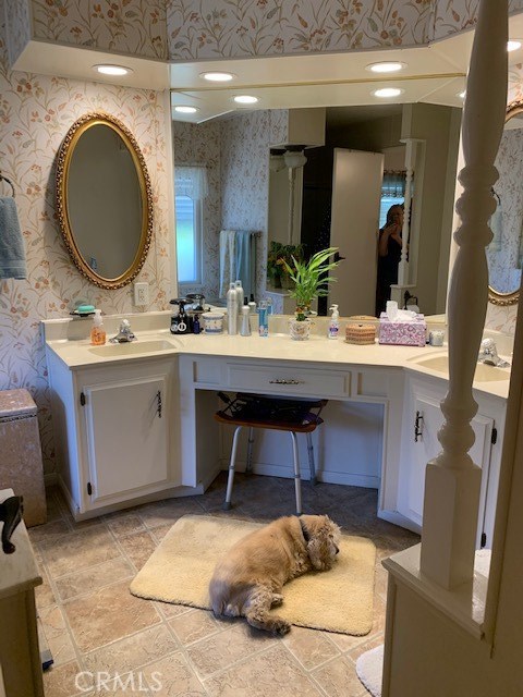 4401 Camelot Place Bakersfield, CA 93301 - Photo 13 of 37 a living room with furniture a mirror and sink