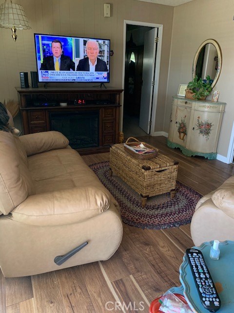 4401 Camelot Place Bakersfield, CA 93301 - Photo 22 of 37 a living room with hard wood flooring and a couch