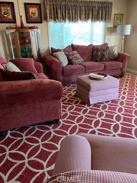 4401 Camelot Place Bakersfield, CA 93301 - Photo 23 of 37 a living room with a couch and wooden floor