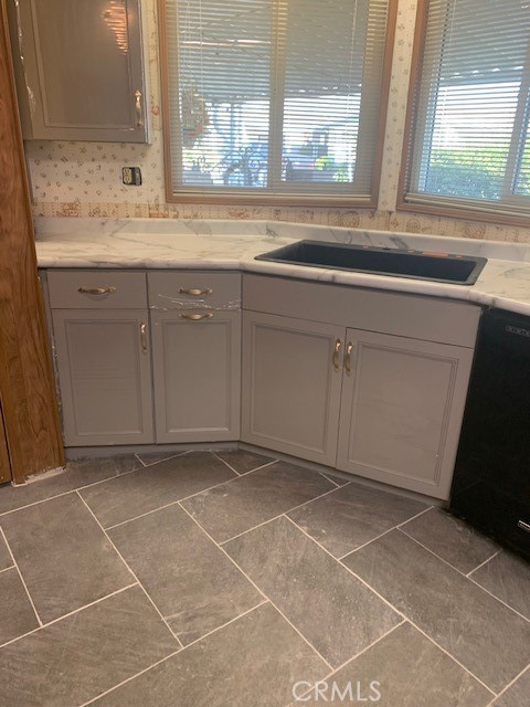 4401 Camelot Place Bakersfield, CA 93301 - Photo 25 of 37 a view of a kitchen with granite countertop a sink and a window