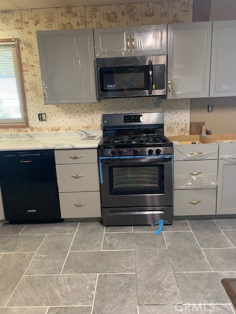 4401 Camelot Place Bakersfield, CA 93301 - Photo 28 of 37 a kitchen with a stove and a sink