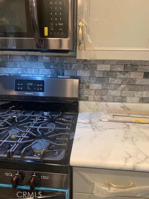 4401 Camelot Place Bakersfield, CA 93301 - Photo 30 of 37 a close view of stove top oven