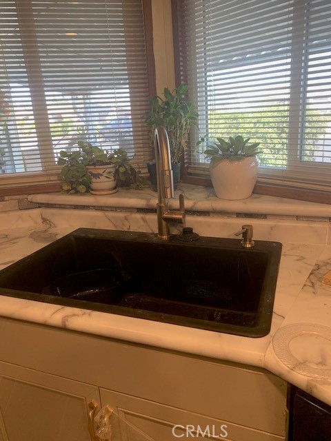 4401 Camelot Place Bakersfield, CA 93301 - Photo 31 of 37 a view of a sink a counter space and a window