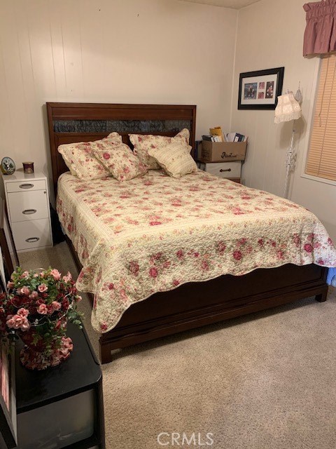 4401 Camelot Place Bakersfield, CA 93301 - Photo 10 of 37 a bed sitting in a bedroom next to a lamp