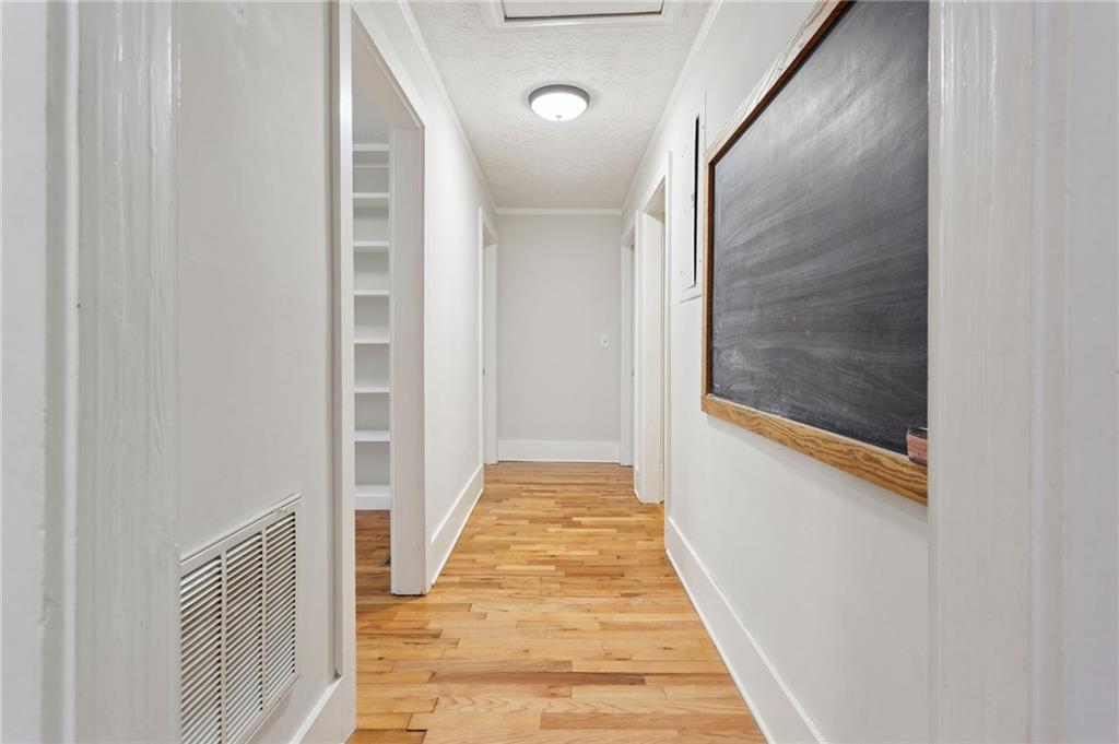 385 Sunset Drive Athens, GA 30606 - Photo 21 of 48 a view of a hallway with wooden floor and glass door
