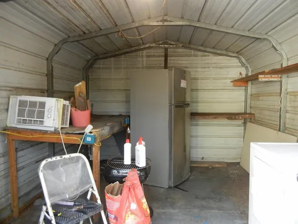 a front view of a house with outdoor seating