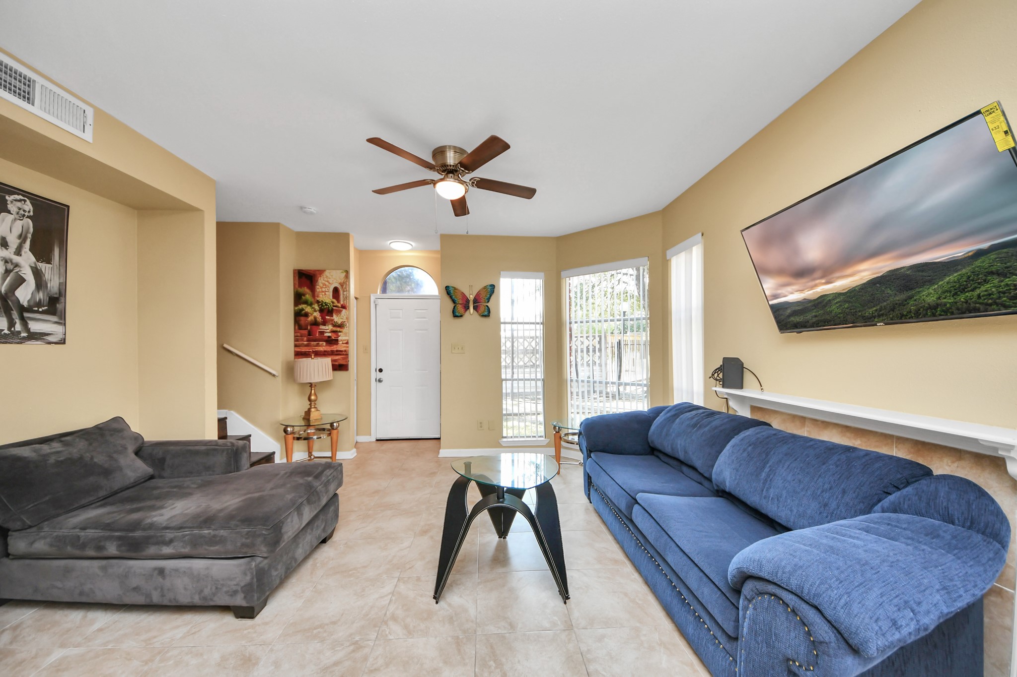13620 Rosewood Street, Unit 3A Houston, TX 77083 - Photo 11 of 25 a living room with furniture and a flat screen tv