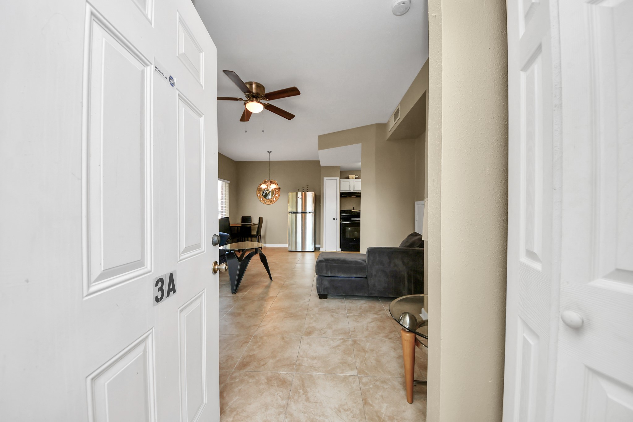 13620 Rosewood Street, Unit 3A Houston, TX 77083 - Photo 8 of 25 a living room with furniture and a couch