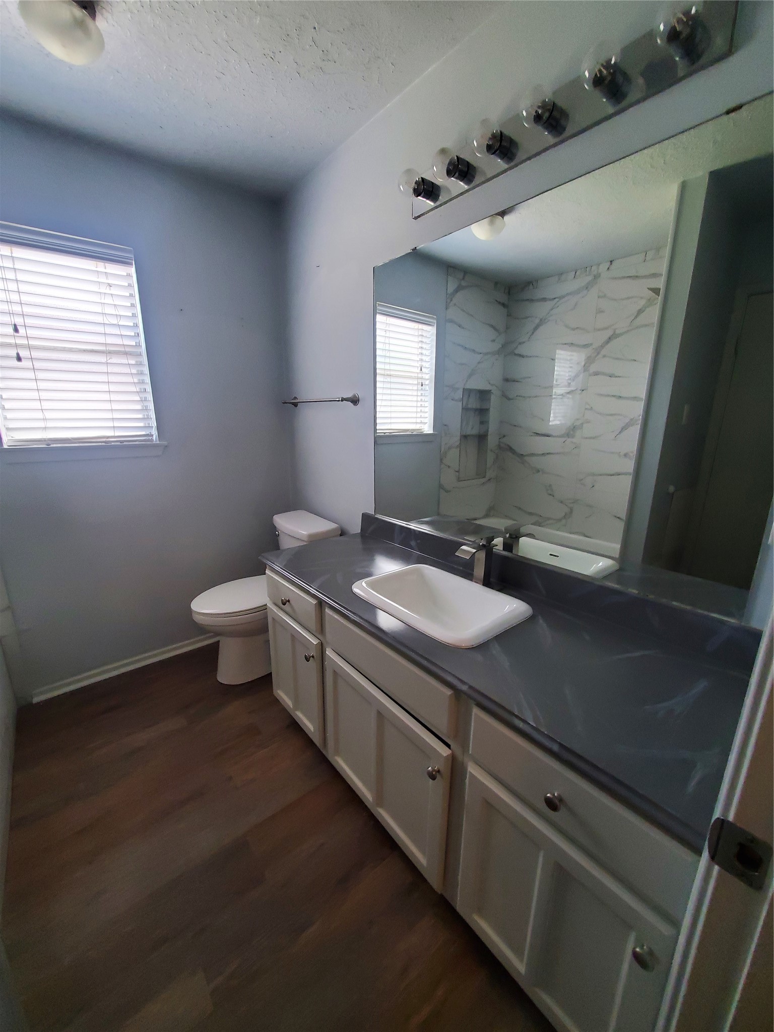 2306 Spring Dusk Drive Spring, TX 77373 - Photo 11 of 12 a bathroom with a granite countertop sink toilet and mirror