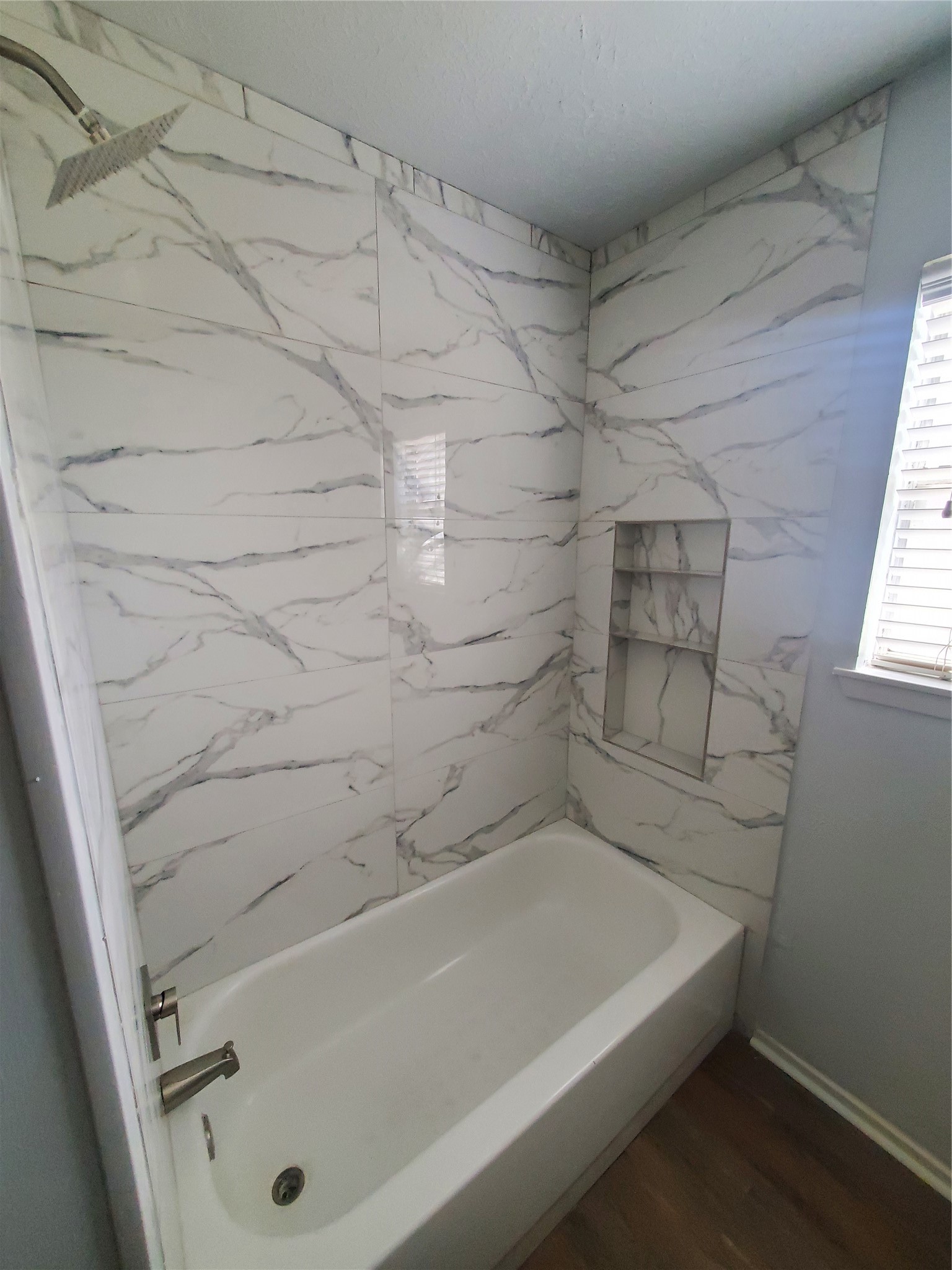 2306 Spring Dusk Drive Spring, TX 77373 - Photo 12 of 12 a bathroom with a tub and a shower