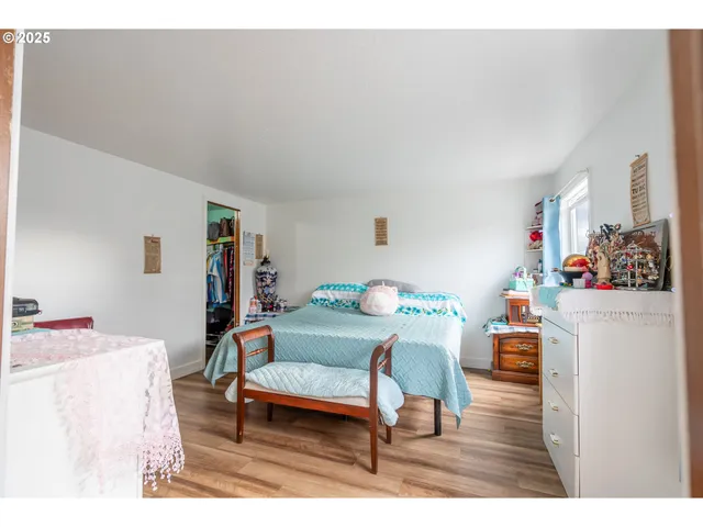 a kitchen with kitchen island a counter top space and a view of living room