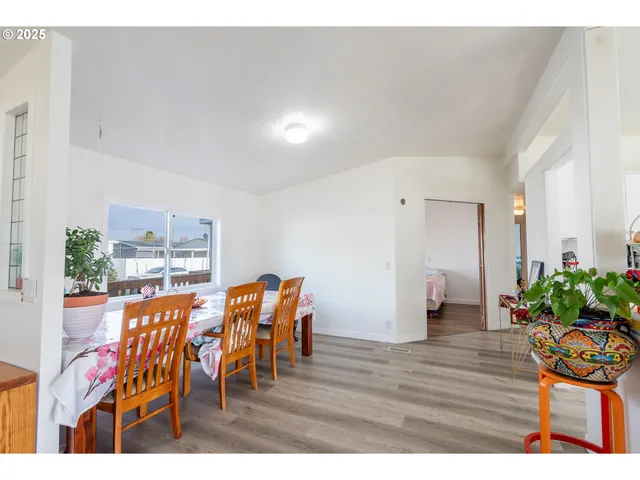a view of a living room and kitchen