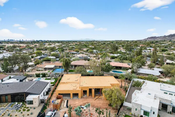 an aerial view of a house with a lake view