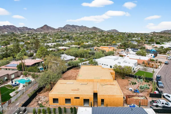 an aerial view of residential houses and outdoor space
