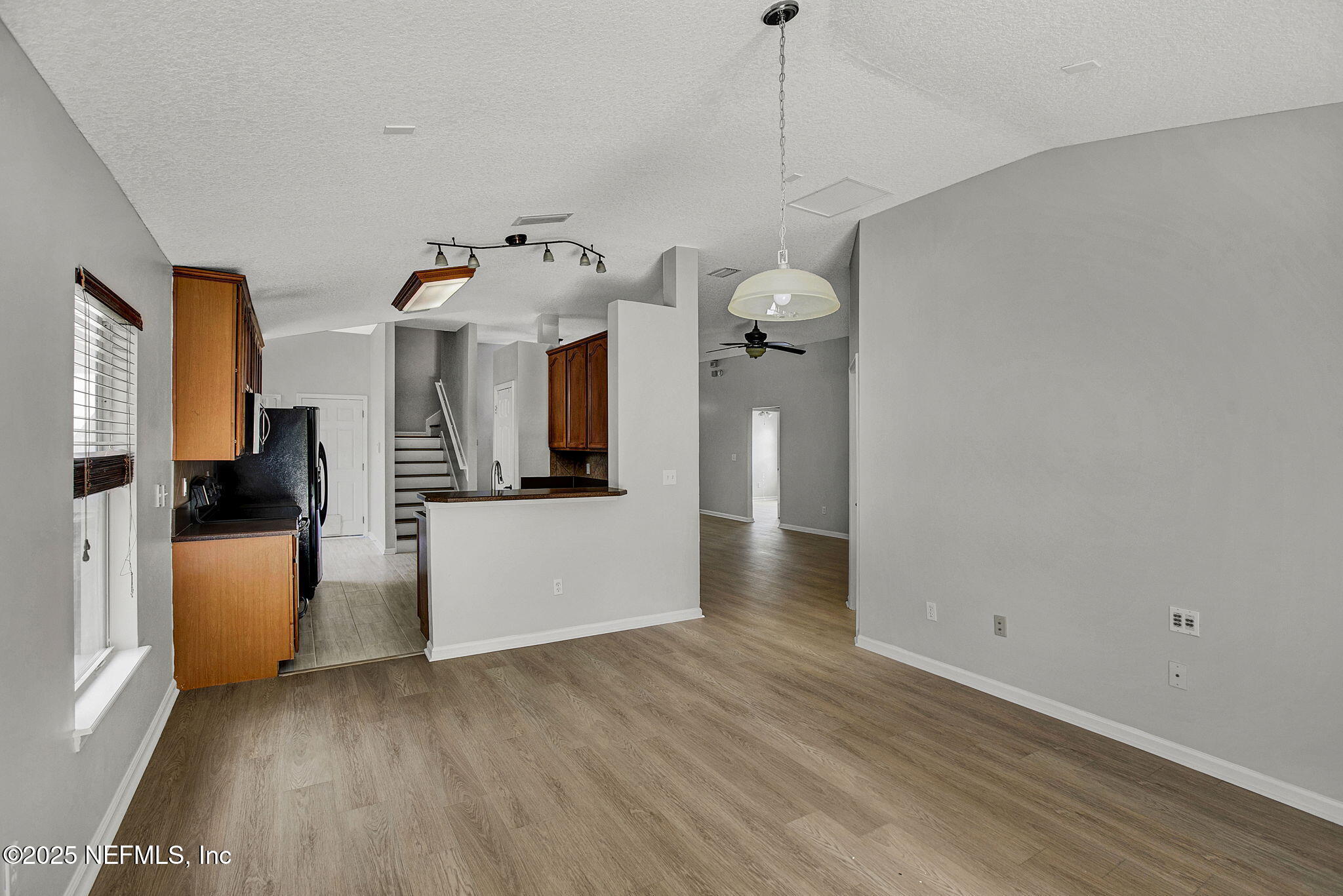 939 Silver Spring Court St. Augustine, FL 32092 - Photo 12 of 31 a view of a house with a kitchen and wooden floor