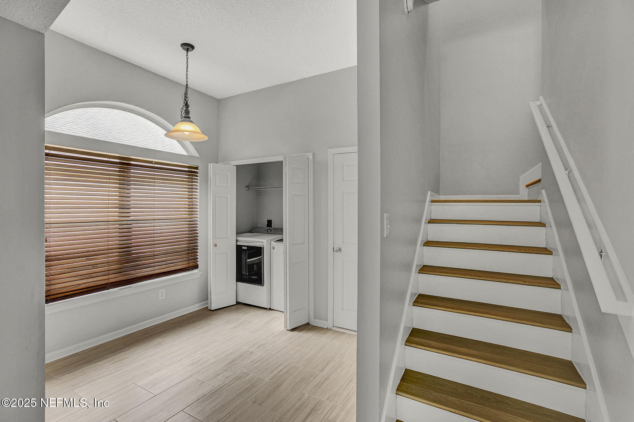 939 Silver Spring Court St. Augustine, FL 32092 - Photo 15 of 31 a view of a kitchen with wooden floor and stairs