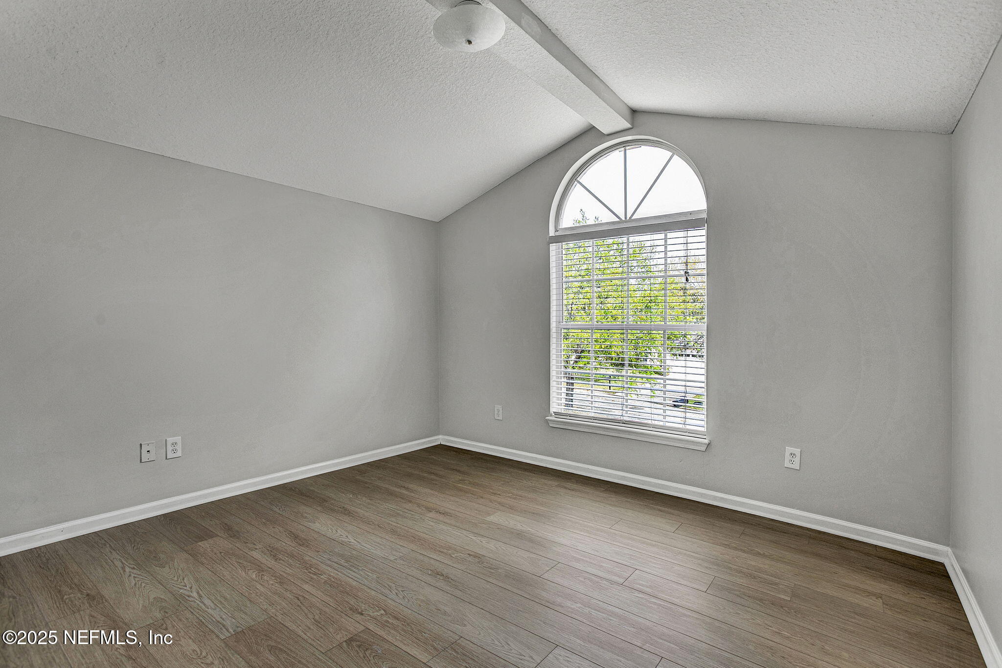 939 Silver Spring Court St. Augustine, FL 32092 - Photo 16 of 31 an empty room with wooden floor windows and closet