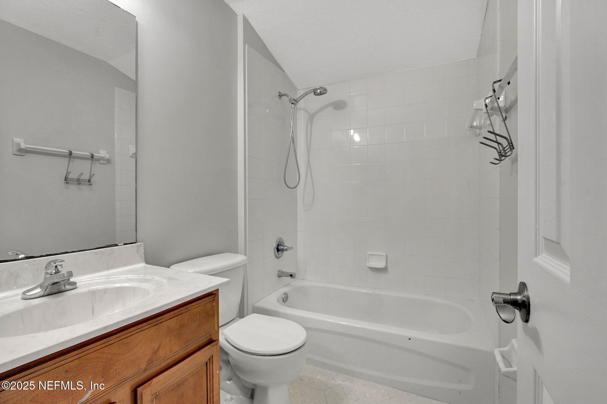 939 Silver Spring Court St. Augustine, FL 32092 - Photo 18 of 31 a bathroom with a granite countertop sink toilet and shower