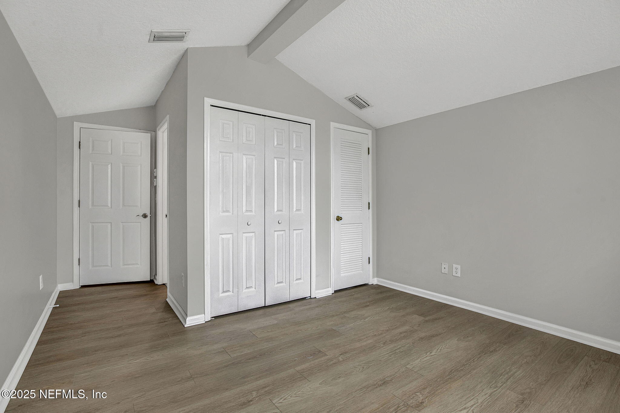 939 Silver Spring Court St. Augustine, FL 32092 - Photo 19 of 31 a view of an empty room with wooden floor