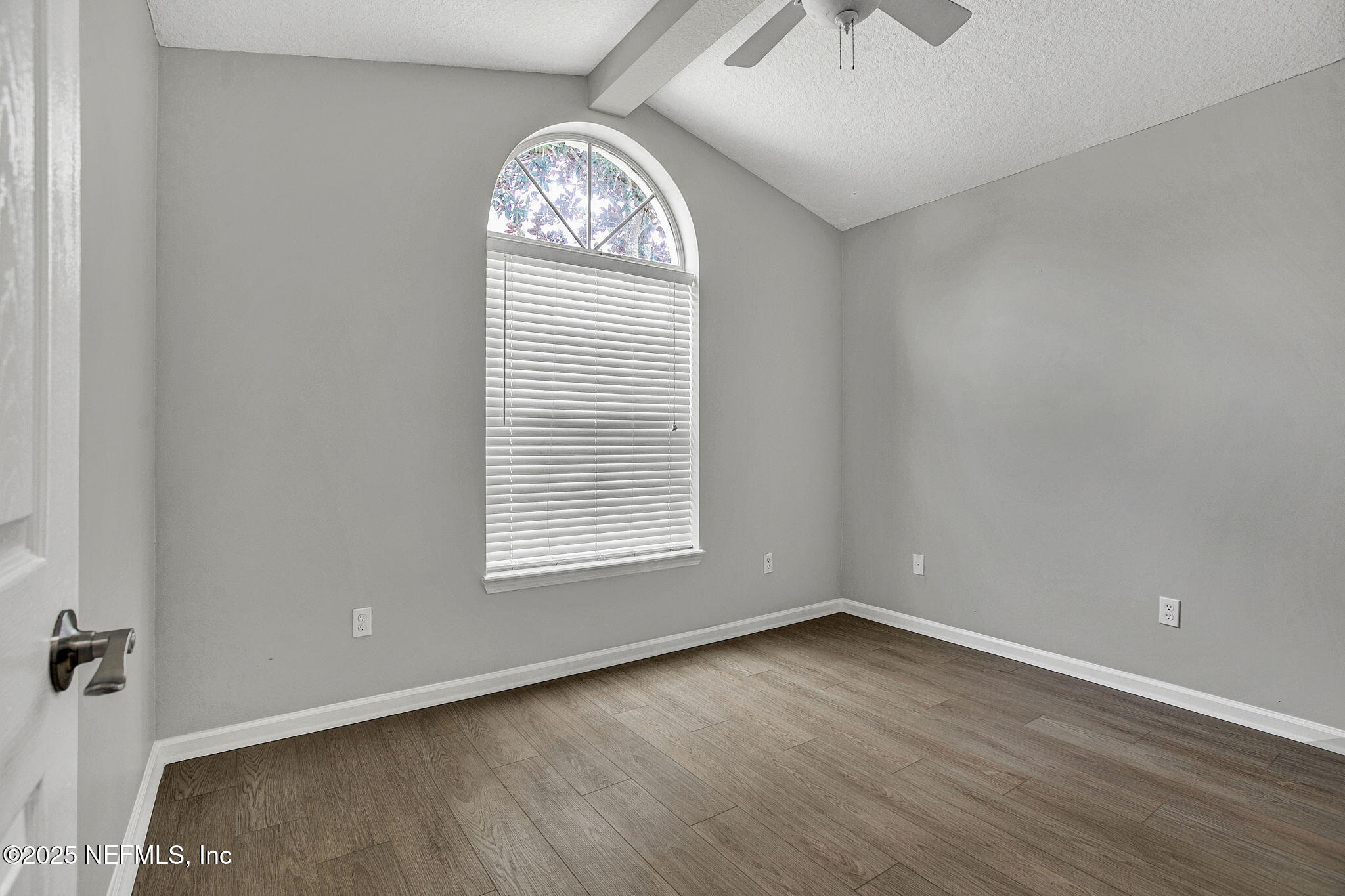 939 Silver Spring Court St. Augustine, FL 32092 - Photo 20 of 31 an empty room with a window and a chandelier