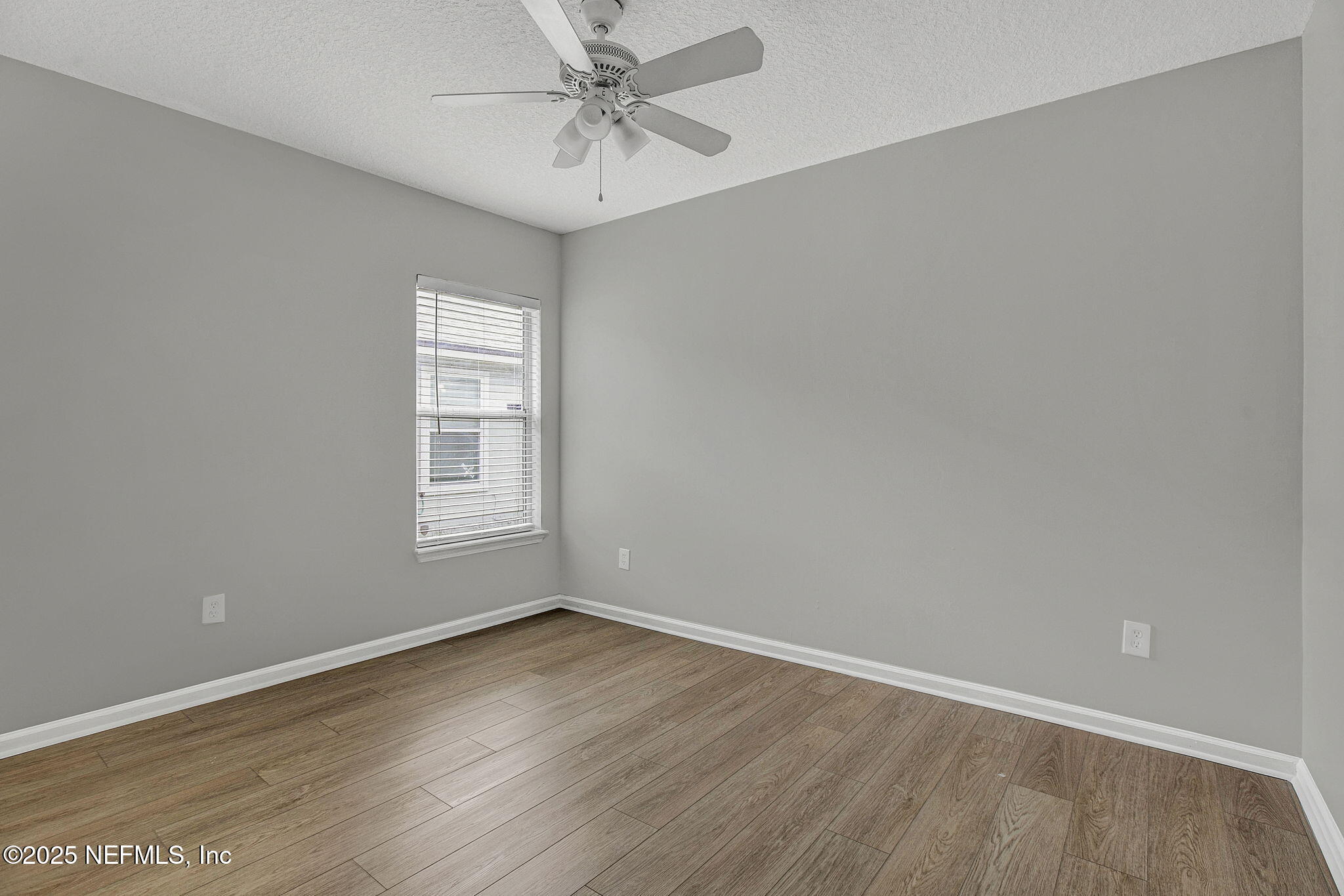 939 Silver Spring Court St. Augustine, FL 32092 - Photo 21 of 31 wooden floor in an empty room with a window