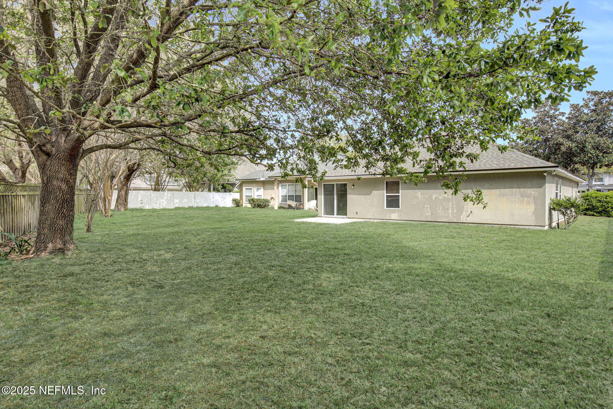 939 Silver Spring Court St. Augustine, FL 32092 - Photo 30 of 31 a front view of a house with a yard and trees