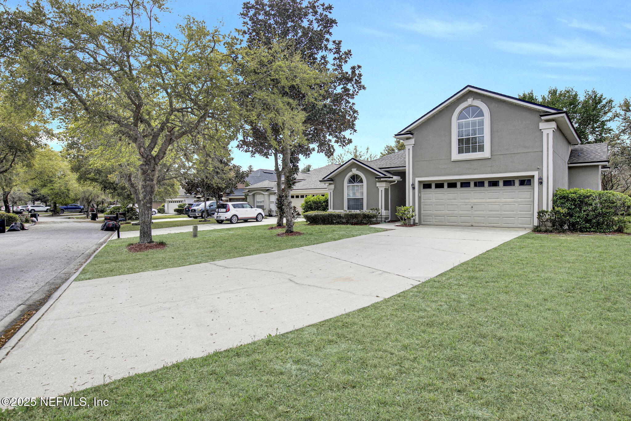 939 Silver Spring Court St. Augustine, FL 32092 - Photo 3 of 31 a front view of a house with a yard and garage