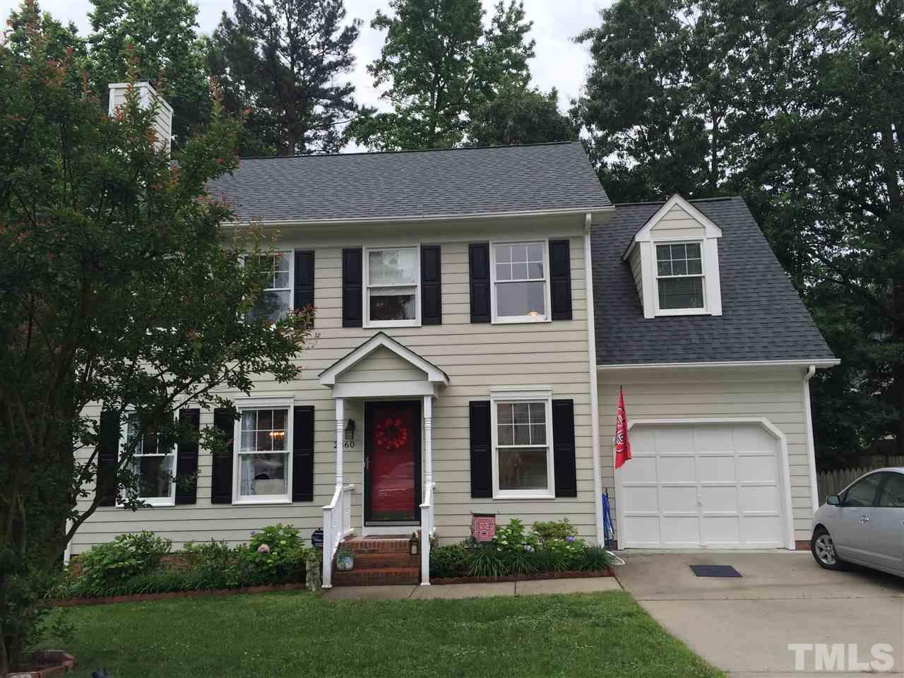 2360 Declaration Drive Raleigh, NC 27615 - Photo 1 of 22 a front view of a house with a yard and garage