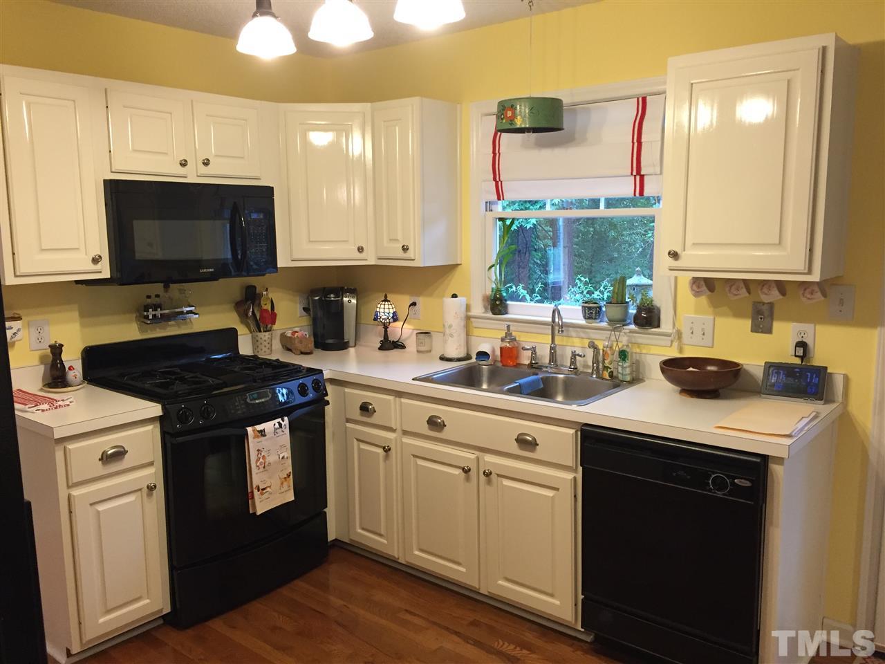 2360 Declaration Drive Raleigh, NC 27615 - Photo 2 of 22 a kitchen with a stove and a sink