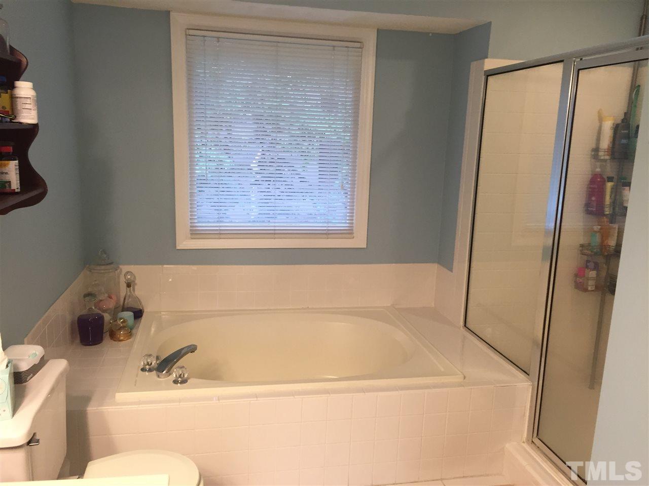 2360 Declaration Drive Raleigh, NC 27615 - Photo 12 of 22 a bath tub sitting next to a white sink