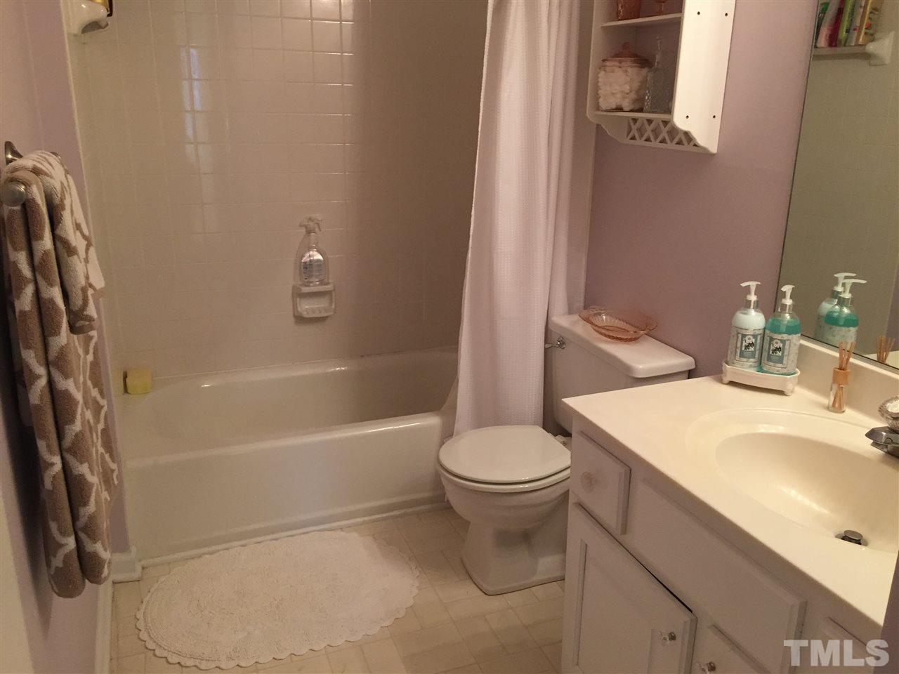 2360 Declaration Drive Raleigh, NC 27615 - Photo 17 of 22 a bathroom with a sink toilet and shower