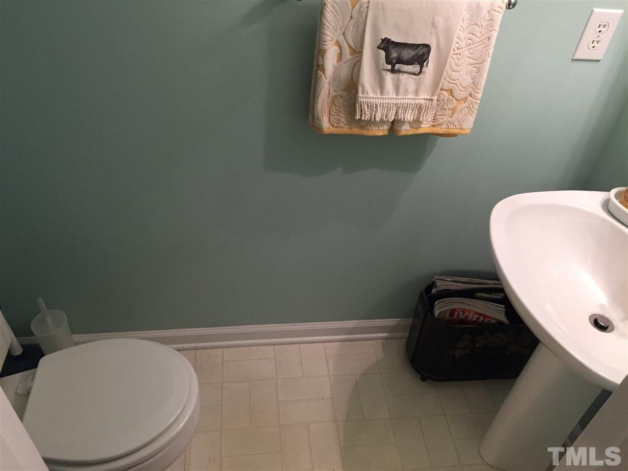 2360 Declaration Drive Raleigh, NC 27615 - Photo 18 of 22 a bathroom with a toilet and a sink