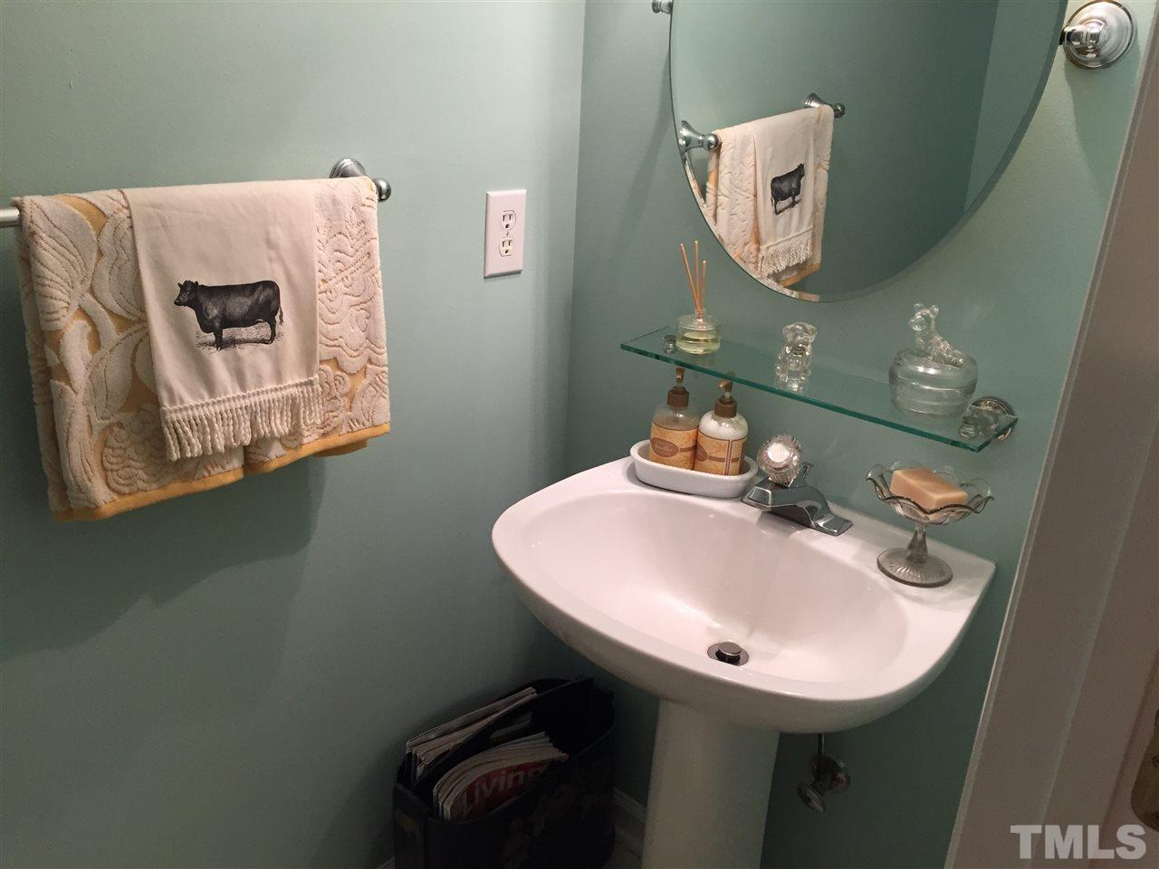 2360 Declaration Drive Raleigh, NC 27615 - Photo 19 of 22 a bathroom with a sink and mirror
