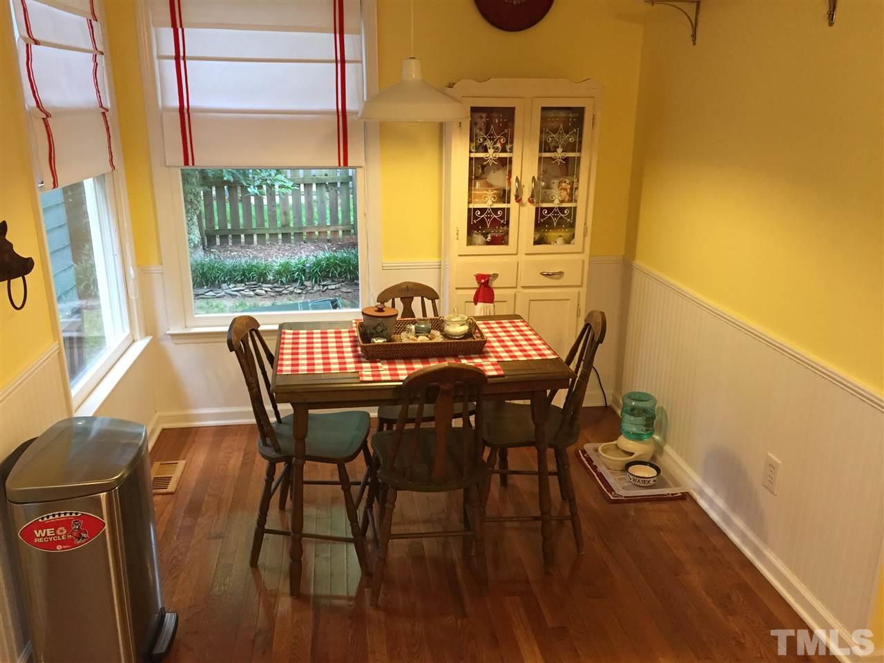 2360 Declaration Drive Raleigh, NC 27615 - Photo 5 of 22 a view of a dining room with furniture and wooden floor