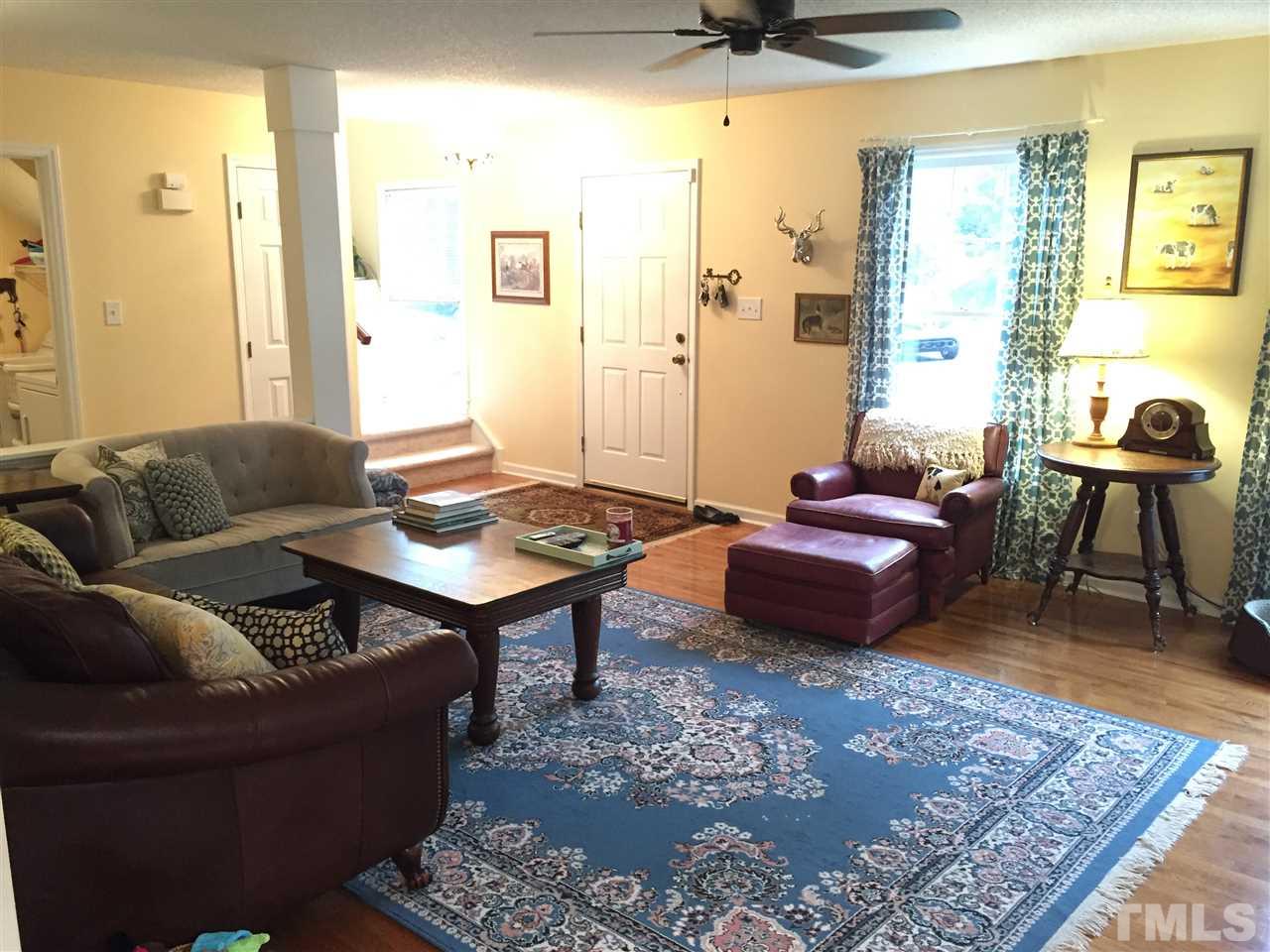 2360 Declaration Drive Raleigh, NC 27615 - Photo 7 of 22 a living room with furniture and a rug