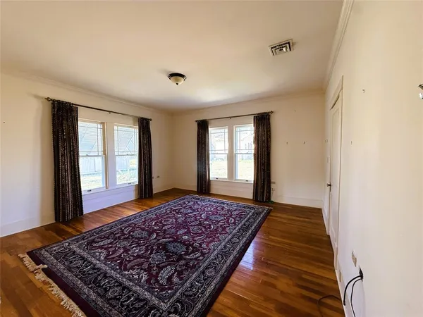 a living room with a rug