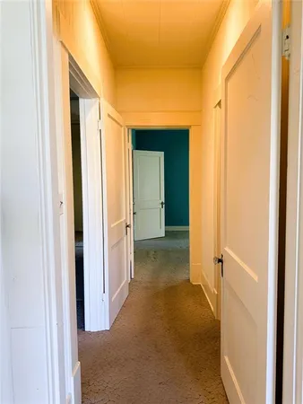 a view of a bathroom from a hallway