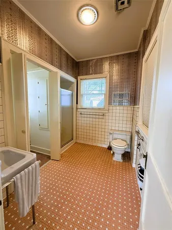 a view of a room with window and chandelier