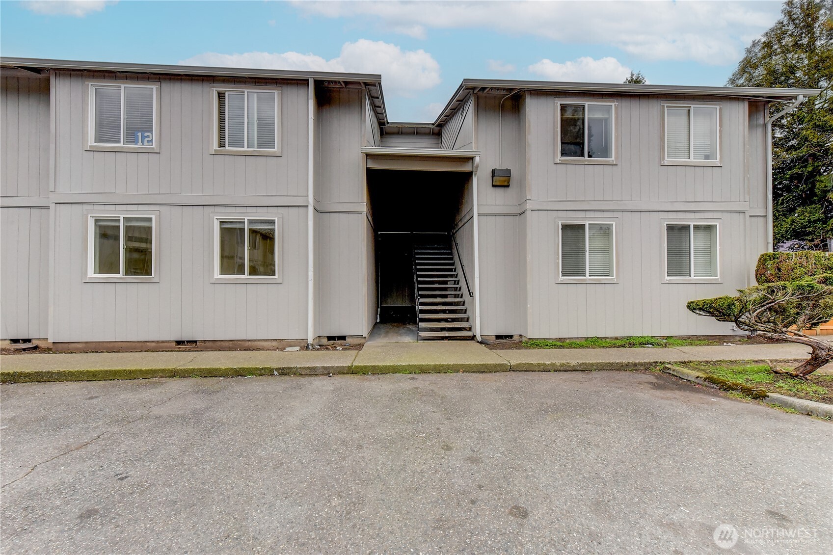 a view of a house with a yard and garage
