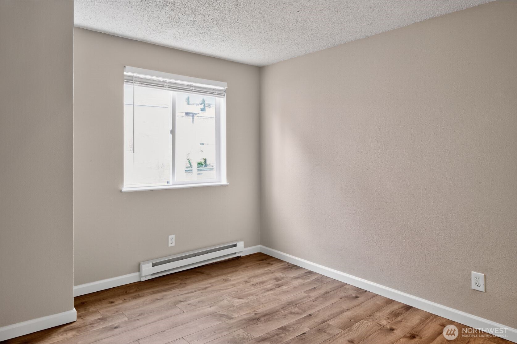 1601 Maple Lane, Unit B1 Kent, WA 98030 - Photo 15 of 20 a view of an empty room with wooden floor and a window
