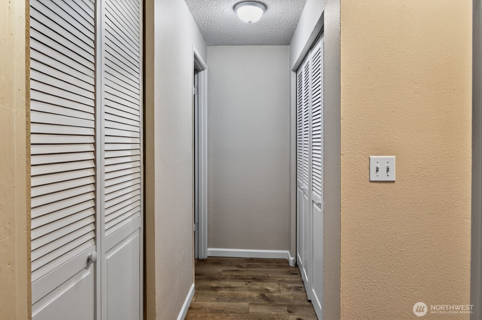 1601 Maple Lane, Unit B1 Kent, WA 98030 - Photo 19 of 20 a view of a hallway with wooden floor