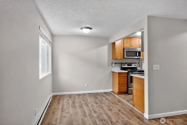 a kitchen with a stove and a microwave