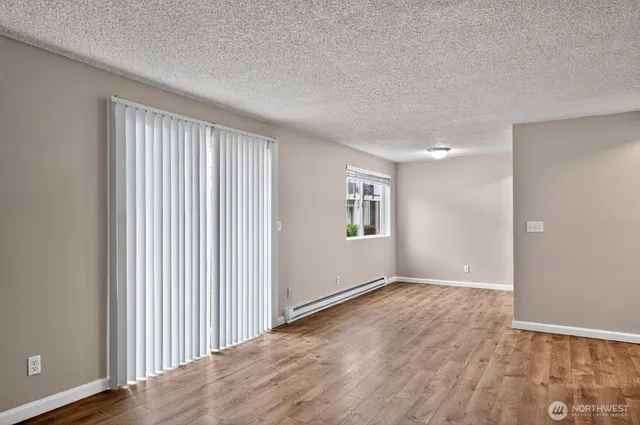 a view of wooden floor in an empty room